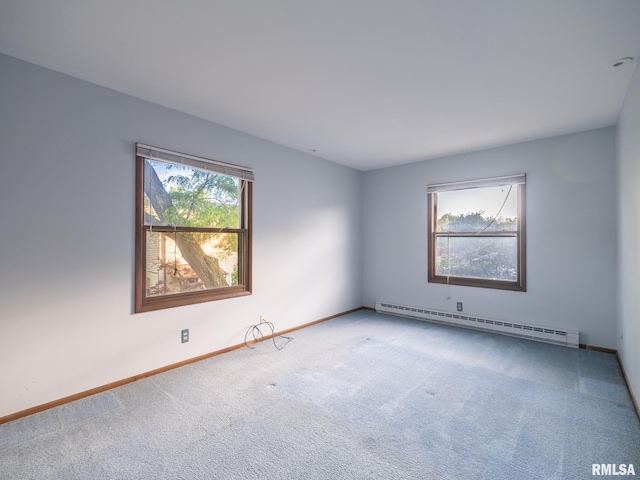 1020 Florence Ave, Pekin, IL 61554 - empty room featuring a baseboard heating unit and carpet flooring