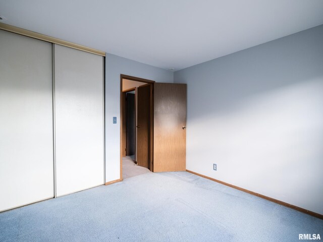 1020 Florence Ave, Pekin, IL 61554 - unfurnished bedroom with a closet and light colored carpet