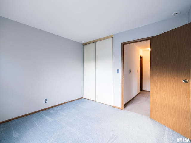 1020 Florence Ave, Pekin, IL 61554 - unfurnished bedroom featuring light carpet and a closet
