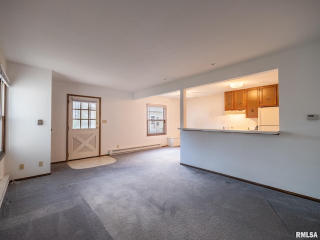 1020 Florence Ave, Pekin, IL 61554 - unfurnished living room featuring baseboard heating and carpet flooring