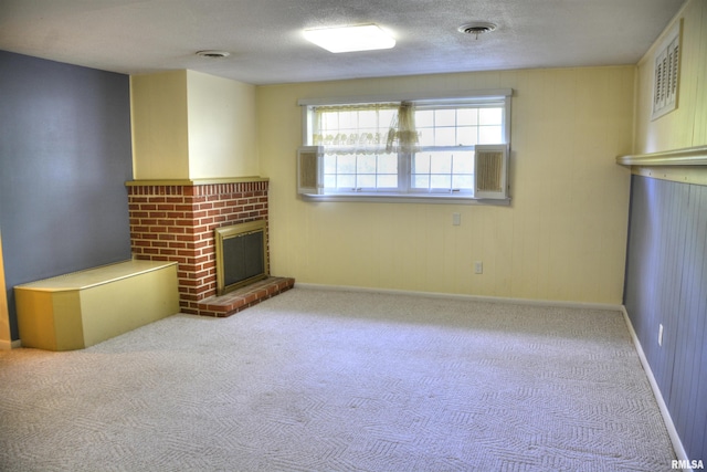 298 Jana Rd, Macomb, IL 61455 - unfurnished living room featuring a brick fireplace, carpet flooring, and baseboards