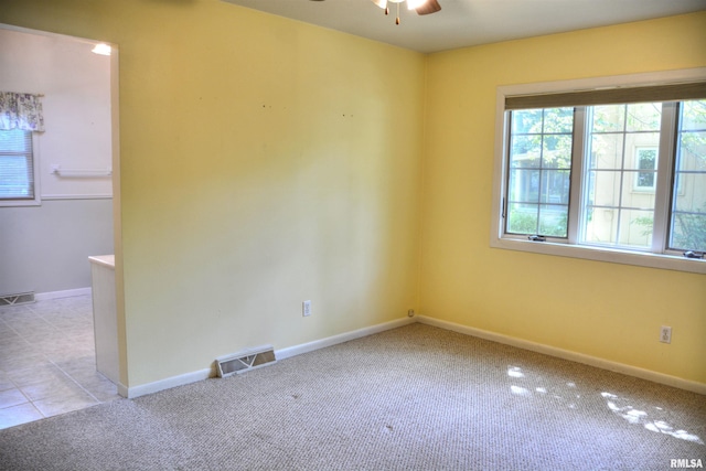 298 Jana Rd, Macomb, IL 61455 - empty room with a ceiling fan, carpet flooring, and baseboards