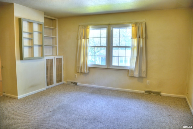 298 Jana Rd, Macomb, IL 61455 - carpeted spare room featuring baseboards