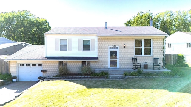 1601 Memorial Dr, Pekin, IL 61554 - view of front facade with a garage, brick siding, asphalt driveway, and a shingled roof