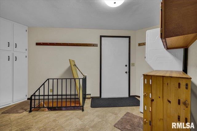 unfurnished bedroom featuring tile patterned floors and a baseboard radiator