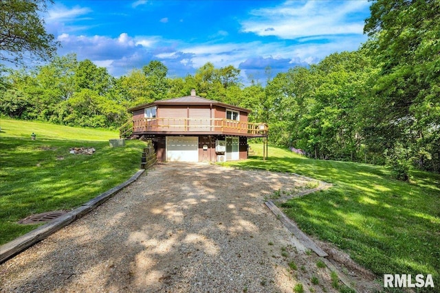 rustic home featuring dirt driveway, a deck, a front yard, an attached garage, and a chimney