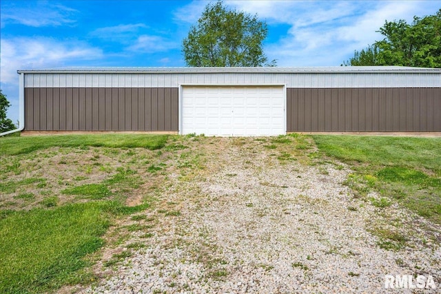 detached garage featuring driveway