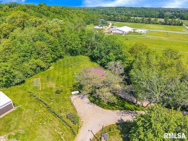 view of rural area with a heavily wooded area