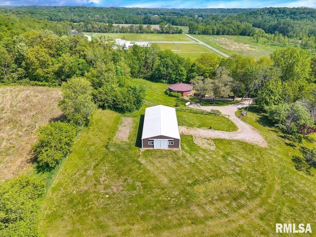 view of rural area featuring a heavily wooded area