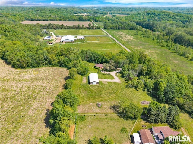 view of rural area featuring a forest