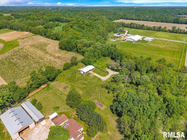 view of property location featuring a heavily wooded area