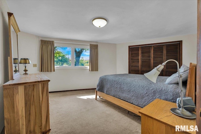 bedroom with carpet floors and baseboards