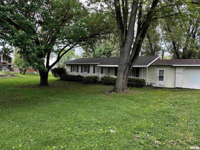 26025 N Weldon Rd, Canton, IL 61520 - ranch-style home featuring an attached garage and a front yard