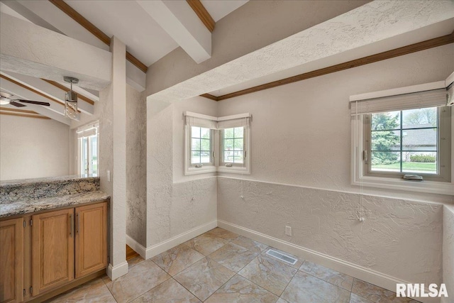 11116 N Oakwood Dr, Peoria, IL 61615 - unfurnished dining area with a textured wall, baseboards, and ceiling fan