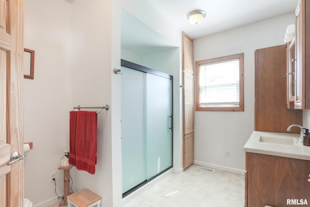 113 W Essex St, Glasford, IL 61533 - bathroom with a stall shower, tile patterned floors, vanity, and baseboards