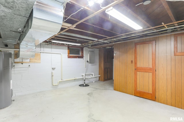 113 W Essex St, Glasford, IL 61533 - unfinished basement featuring water heater, wood walls, and drainage system