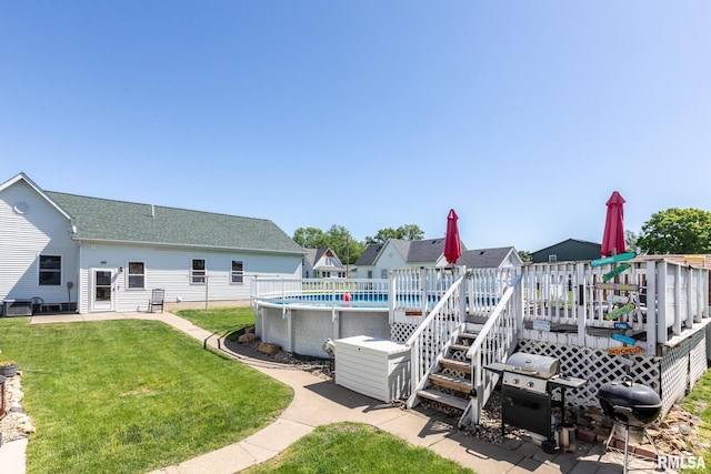 113 W Essex St, Glasford, IL 61533 - view of green lawn with a wooden deck