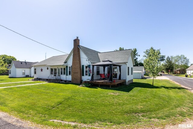 113 W Essex St, Glasford, IL 61533 - view of front of house featuring a gazebo, a front yard, and a chimney
