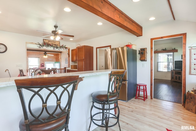 113 W Essex St, Glasford, IL 61533 - kitchen with freestanding refrigerator, a ceiling fan, light wood finished floors, a breakfast bar, and recessed lighting