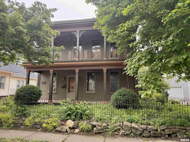 429 S Madison St, Macomb, IL 61455 - view of front of property with a balcony, fence, and a porch