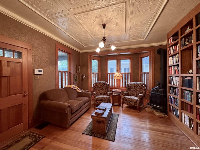 429 S Madison St, Macomb, IL 61455 - living area featuring an ornate ceiling, light wood finished floors, and a textured wall