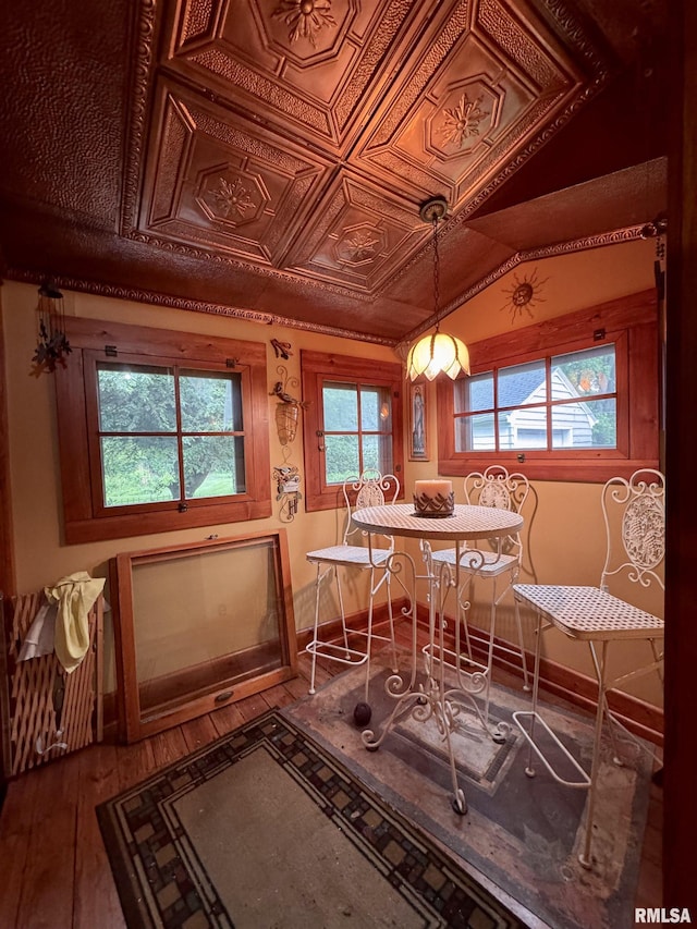 429 S Madison St, Macomb, IL 61455 - dining area with hardwood / wood-style flooring, baseboards, and an ornate ceiling
