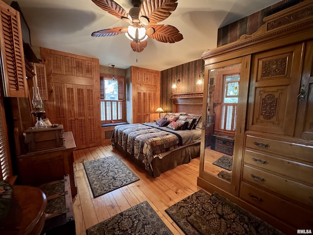 429 S Madison St, Macomb, IL 61455 - bedroom with light wood-style flooring and multiple windows
