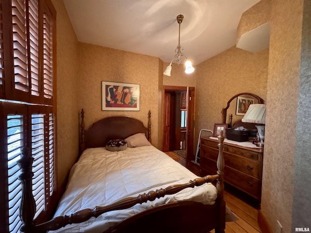 429 S Madison St, Macomb, IL 61455 - bedroom with wood finished floors and vaulted ceiling
