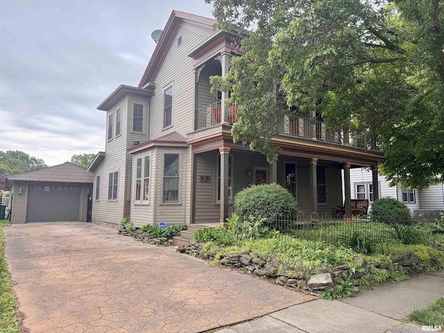 429 S Madison St, Macomb, IL 61455 - view of front of property with an outdoor structure, driveway, a detached garage, and a balcony