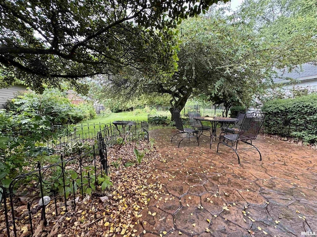 429 S Madison St, Macomb, IL 61455 - view of yard with a patio area, fence, and outdoor dining space