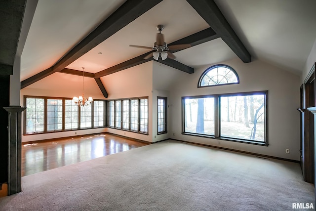 unfurnished living room featuring carpet flooring, a chandelier, baseboards, and a ceiling fan