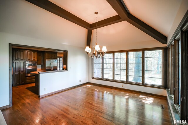 unfurnished dining area with a chandelier, high vaulted ceiling, beam ceiling, dark wood finished floors, and baseboards