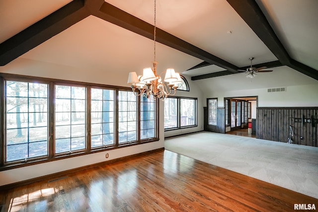 unfurnished living room with a chandelier, beamed ceiling, a ceiling fan, wood finished floors, and high vaulted ceiling
