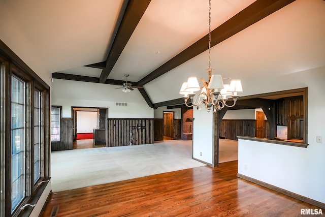 unfurnished living room featuring ceiling fan, beam ceiling, wood finished floors, a chandelier, and high vaulted ceiling