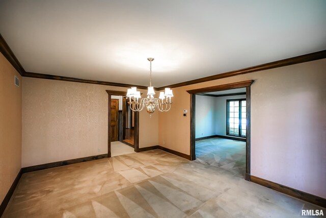 spare room with a chandelier, ornamental molding, light colored carpet, and baseboards