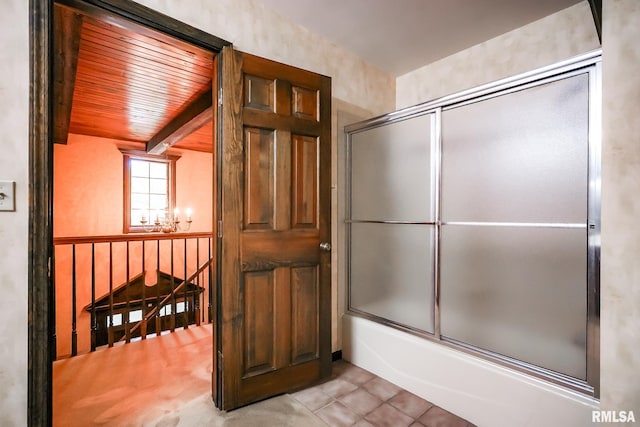 full bathroom featuring beamed ceiling, tile patterned flooring, enclosed tub / shower combo, a chandelier, and wood ceiling