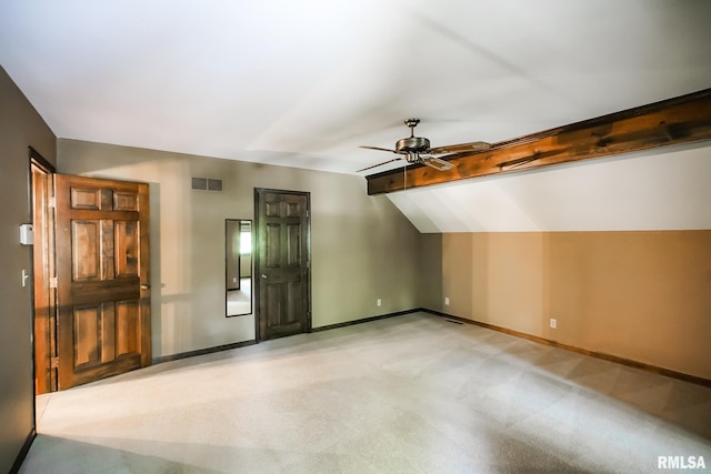 additional living space featuring a ceiling fan, baseboards, and light colored carpet