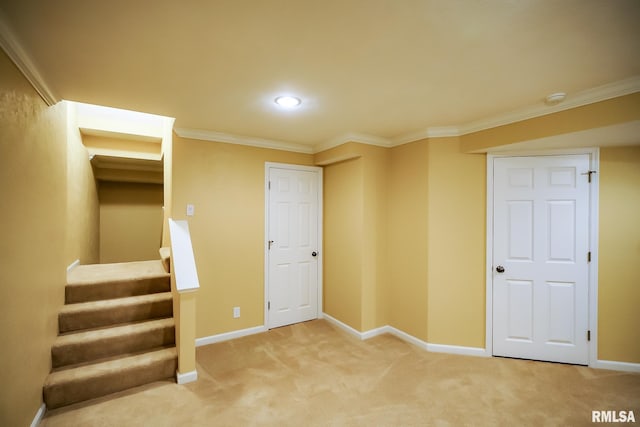 below grade area featuring baseboards, ornamental molding, carpet, stairway, and recessed lighting