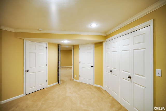 finished below grade area featuring crown molding, light carpet, baseboards, and recessed lighting