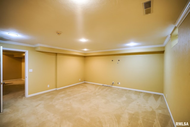 finished below grade area featuring crown molding, light carpet, baseboards, and recessed lighting