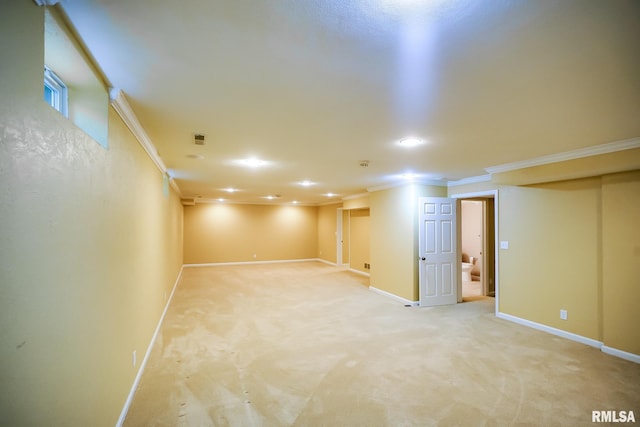 finished basement featuring crown molding, baseboards, recessed lighting, and light carpet