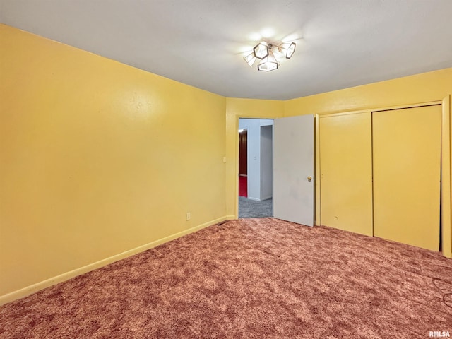 6006 N Big Hollow Rd, Peoria, IL 61615 - unfurnished bedroom with carpet floors, a closet, and baseboards