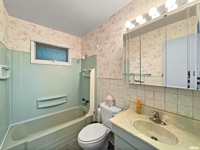 6006 N Big Hollow Rd, Peoria, IL 61615 - bathroom featuring wallpapered walls, vanity, bathtub / shower combination, toilet, and wainscoting