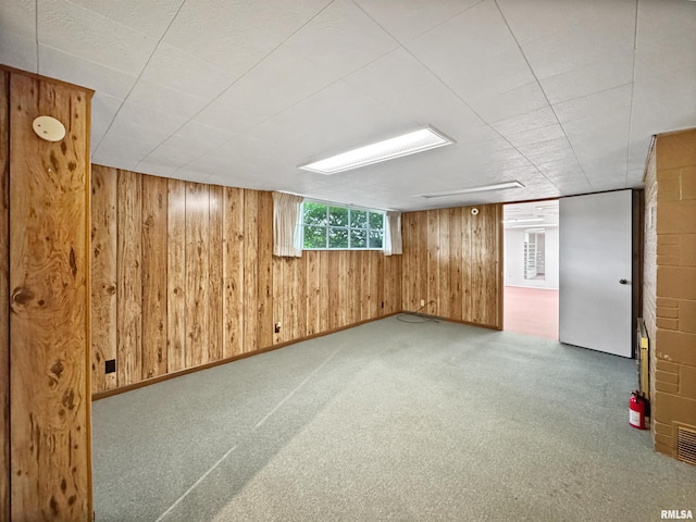 6006 N Big Hollow Rd, Peoria, IL 61615 - basement with wooden walls and carpet flooring