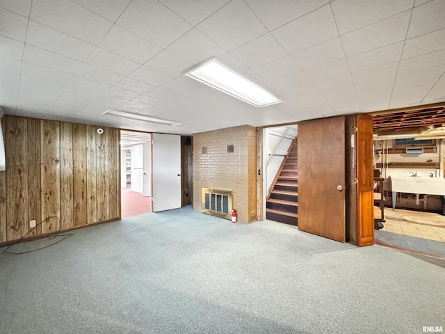 6006 N Big Hollow Rd, Peoria, IL 61615 - finished below grade area featuring wood walls, stairway, a brick fireplace, carpet floors, and a sink