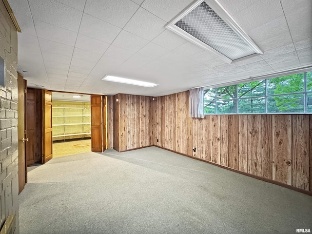 6006 N Big Hollow Rd, Peoria, IL 61615 - basement with light carpet and wooden walls