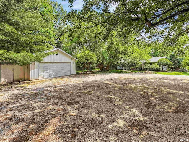 6006 N Big Hollow Rd, Peoria, IL 61615 - view of yard featuring a garage and an outbuilding