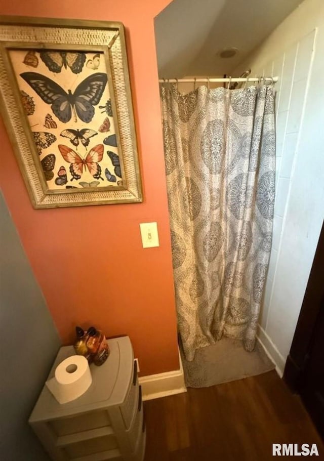 405 Washington St, Pekin, IL 61554 - bathroom featuring wood finished floors, baseboards, and a shower with curtain