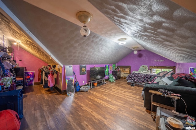 405 Washington St, Pekin, IL 61554 - bedroom featuring wood finished floors, vaulted ceiling, and baseboards