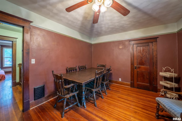 405 Washington St, Pekin, IL 61554 - dining space featuring ceiling fan, hardwood / wood-style floors, and baseboards